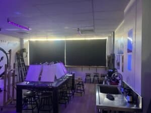 Blockout Roller Blinds Classroom with blockout roller blinds fully closed, creating a dark environment ideal for presentations or media viewing.
