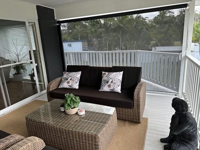 Outdoor roller blind on balcony for shade, privacy, and UV protection