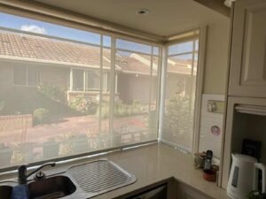 Sheer Roller Blind Kitchen Freshly installed insect screen window blinds offering protection and enhancing comfort.