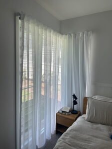 Curtains for L-Shaped Windows – Custom Fit & Coverage Custom curtains installed on an L-shaped corner window for full coverage