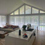 Sheer curtains installed in a Central Coast living room, allowing filtered natural light while maintaining privacy