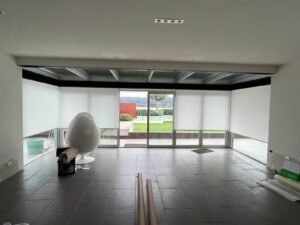 Light filtering roller blinds installed in a Central Coast penthouse apartment, offering privacy and soft natural light with ocean views
