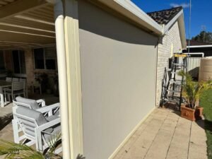 White outdoor roller blinds for modern patio shade and privacy