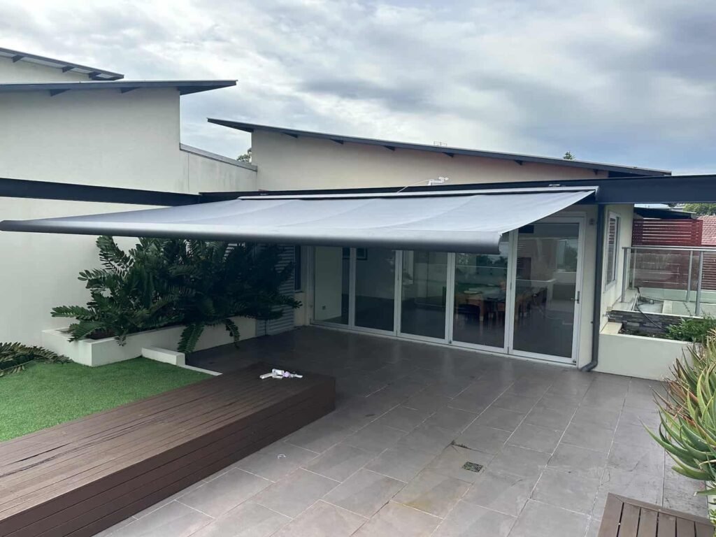 8.2 metre wide outdoor awning covering a full-length patio
