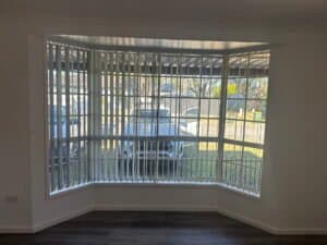 Vertical blinds fitted to bay windows in a contemporary home interior