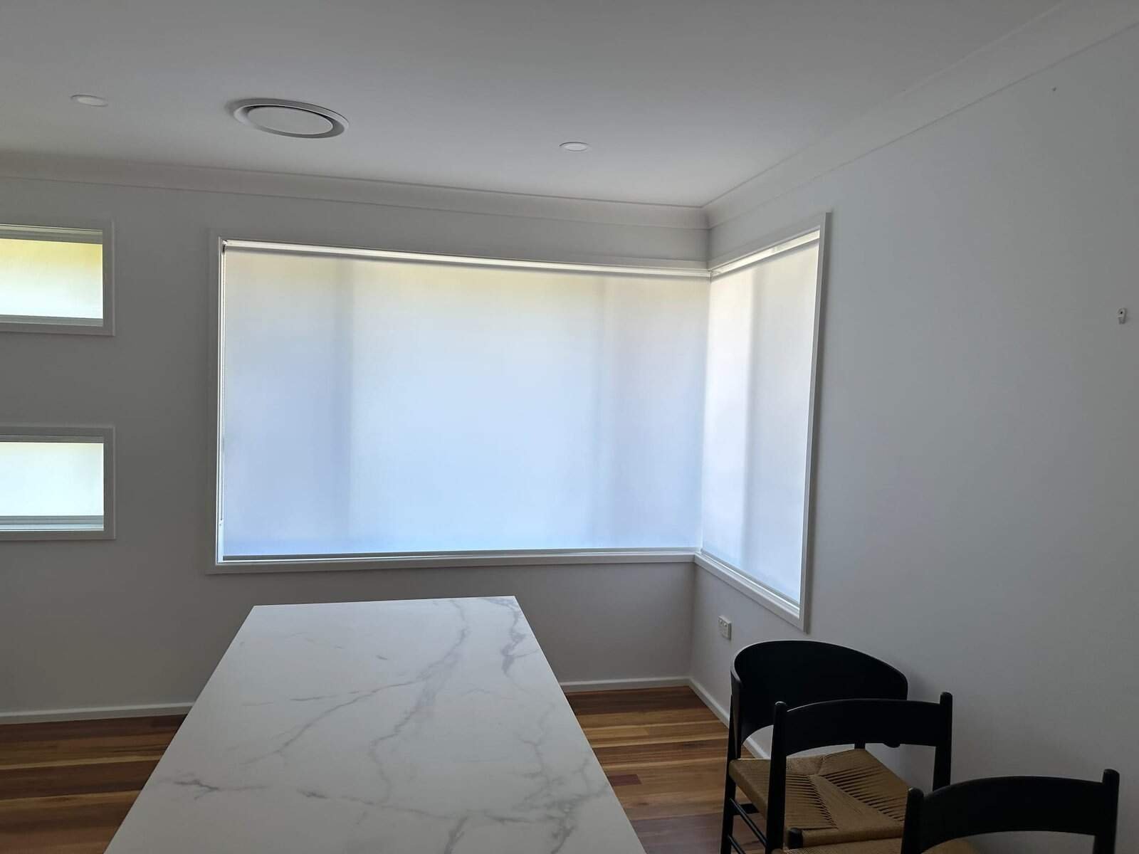 Light Filtering Roller Blinds Central Coast – Dining Room Install Light filtering roller blinds installed in a Central Coast dining room, providing privacy and soft natural light