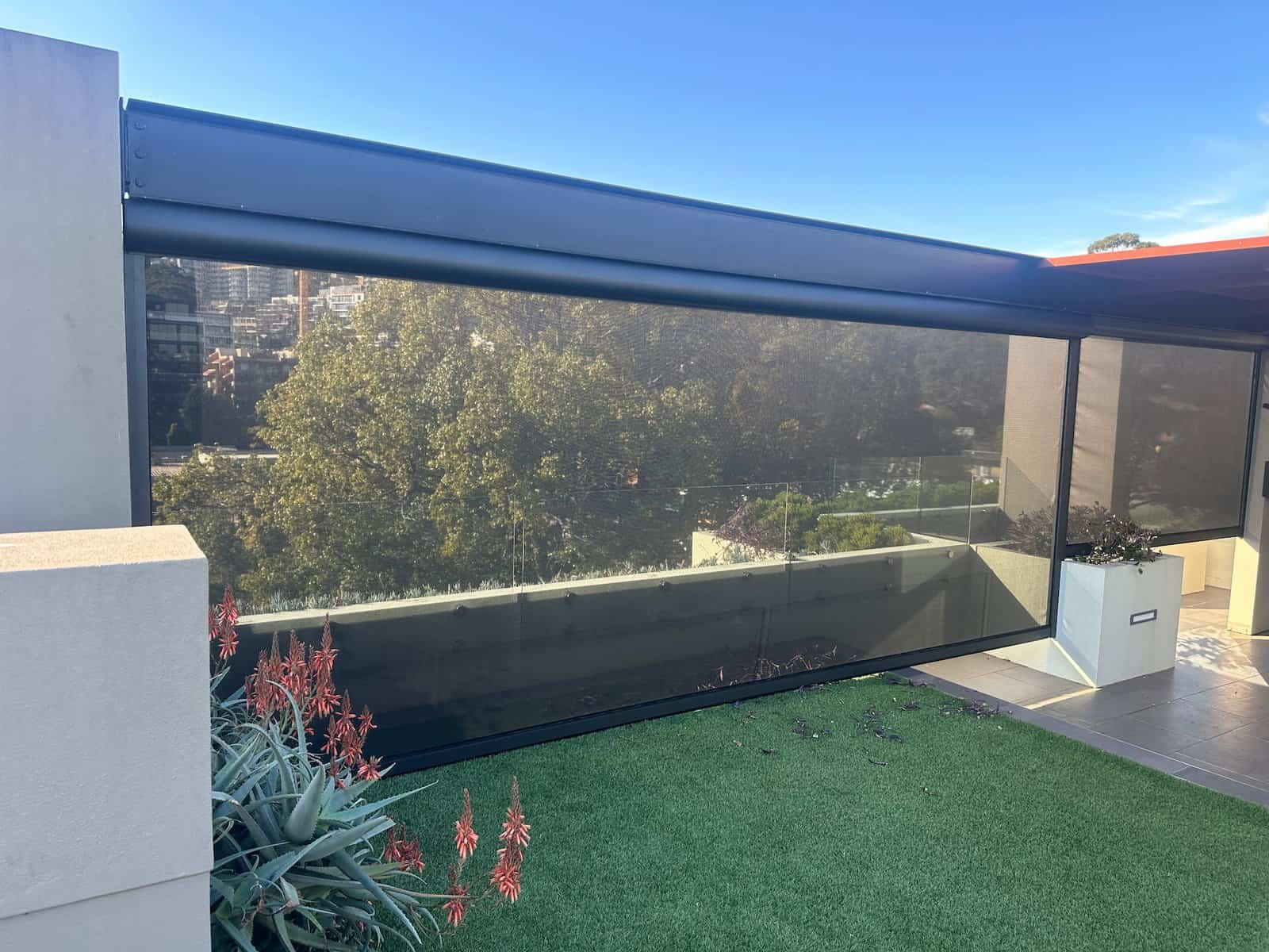 Storm Zip Blind Storm zip blind installed on a Central Coast outdoor area, providing all-weather protection with a sealed edge track system