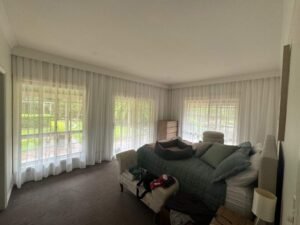 Sheer curtains in bedroom with natural light, privacy, and modern style
