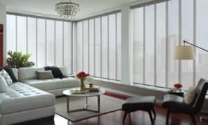 Panel blinds - Ideal for Large Windows & Doors. Panel glide blinds covering wide windows in a stylish contemporary room