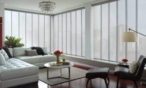 Panel glide blinds installed on wide sliding doors in a Central Coast home, offering smooth operation and modern privacy