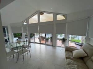 Roller Blinds - Coastal Living Room Installation roller blinds in coastal living room with vaulted ceiling and large windows
