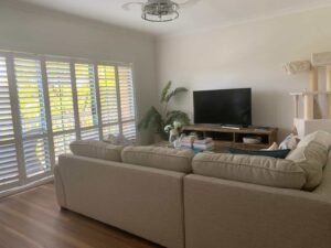 PVC Plantation Shutters – Loungeroom Central Coast PVC plantation shutters in loungeroom windows providing privacy, airflow, and modern style
