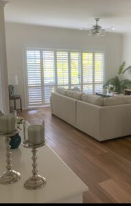 Six-Panel Plantation Shutters – Wide Coverage & Seamless Design Six-panel plantation shutters installed across wide windows for elegant light control
