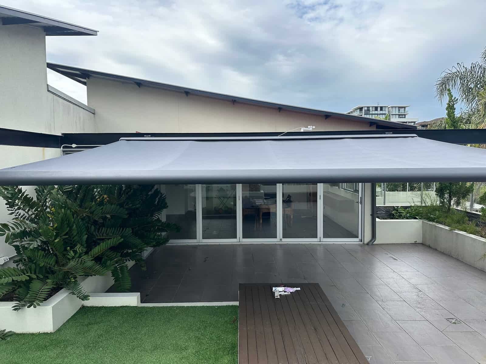 8-Metre Folding Arm Awning – Expansive Shade for Outdoor Living 8m folding arm awning providing wide shade coverage on Central Coast patio