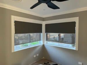 Day and Night Double Roller Blinds Day and night double roller blinds installed in a corner window setup, combining privacy and light filtering.
