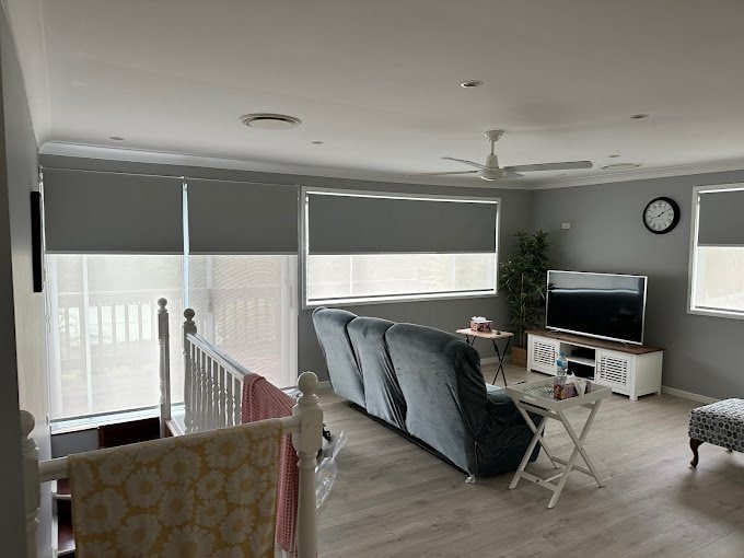 Double roller blinds on window with blockout and light filtering fabrics