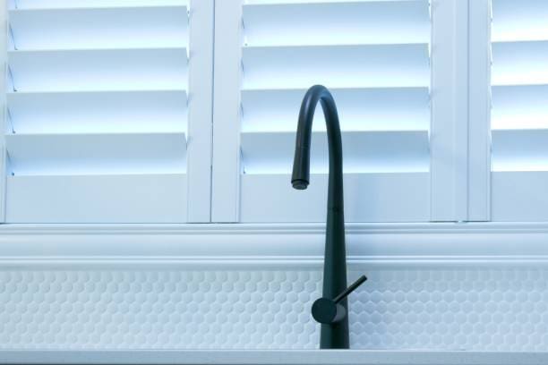 Plantation Shutters Above Sink – Durable & Water-Resistant Moisture-resistant plantation shutters above a kitchen sink