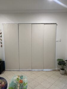 Panel blinds installed in an Erina home loungeroom, providing a sleek and modern window covering solution