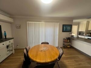 Vertical blinds on sliding door Central Coast – stylish, affordable, and practical window covering.