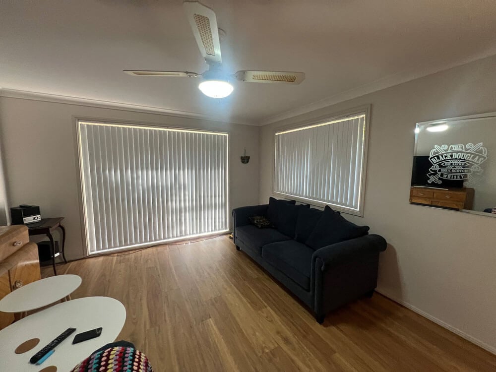 Are Vertical Blinds Aesthetically Pleasing Are vertical blinds aesthetically pleasing in a modern living space with natural light.