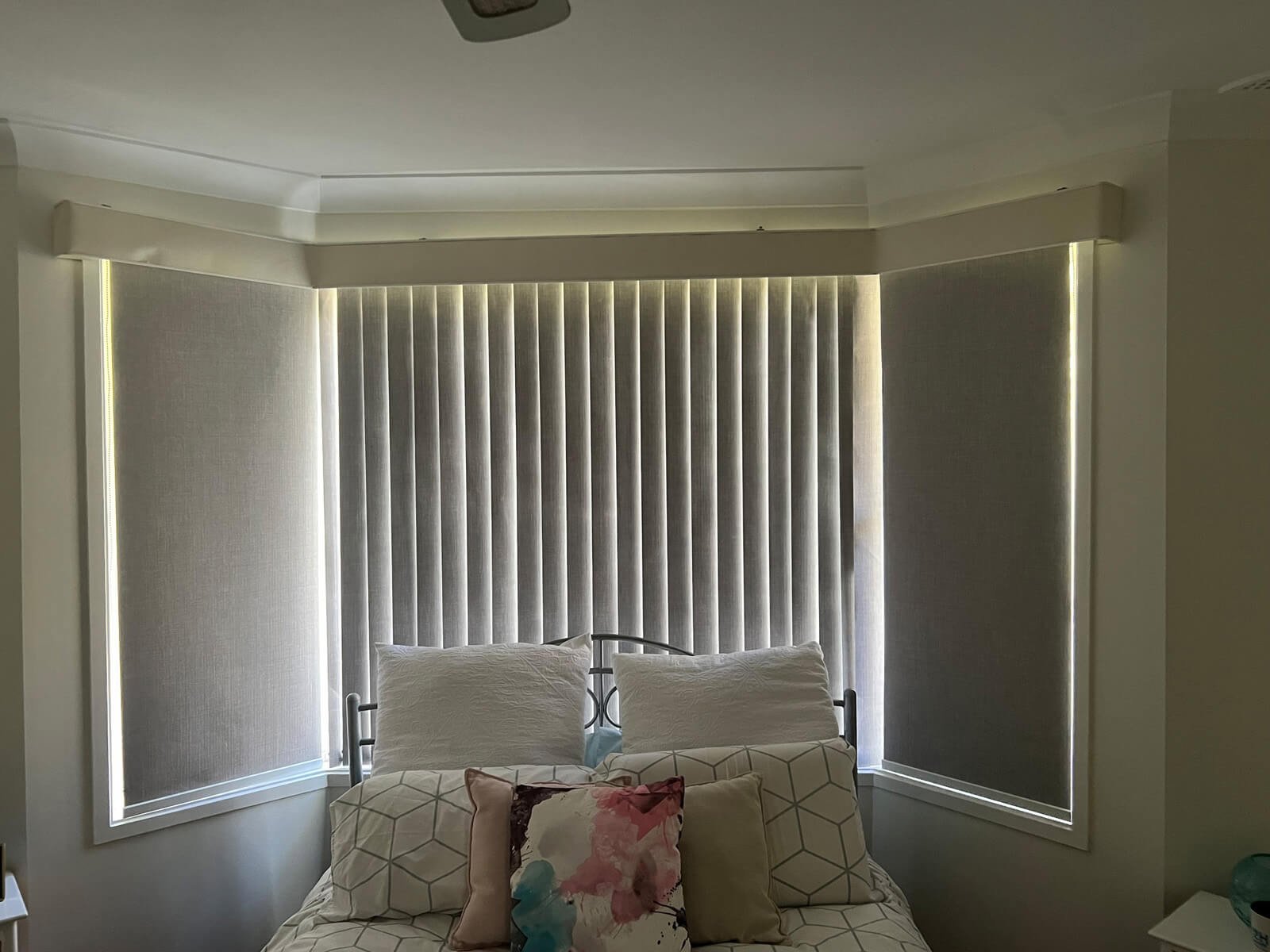 Vertical Blinds for Bay Windows – Modern Light Control Solution Vertical blinds on bay windows in a contemporary lounge room