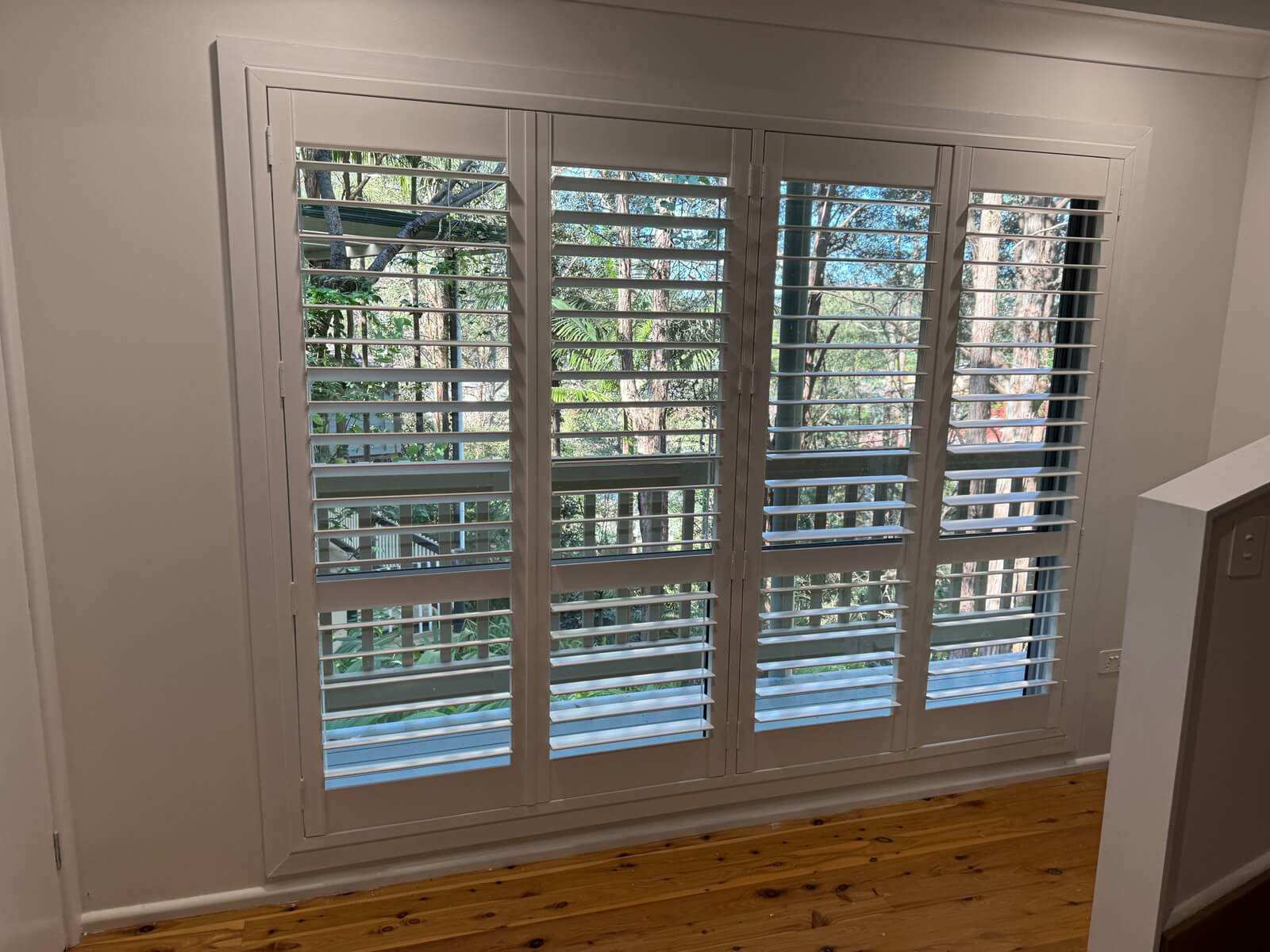 Blinds for Large Windows Elegant blinds for large windows providing full light control and privacy in a spacious modern living area.