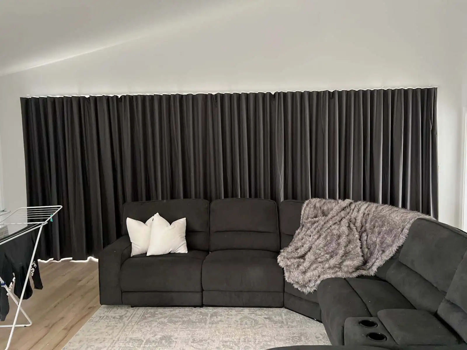 Curtains offer Noise reduction in a modern living room.
