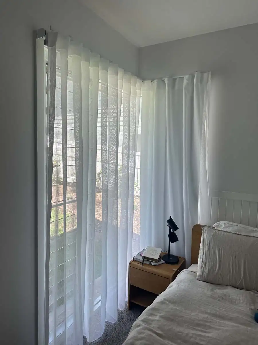 Do curtains provide daytime privacy and energy efficiency Sheer curtains diffusing natural light while providing daytime privacy and improving energy efficiency in a modern Australian living room.