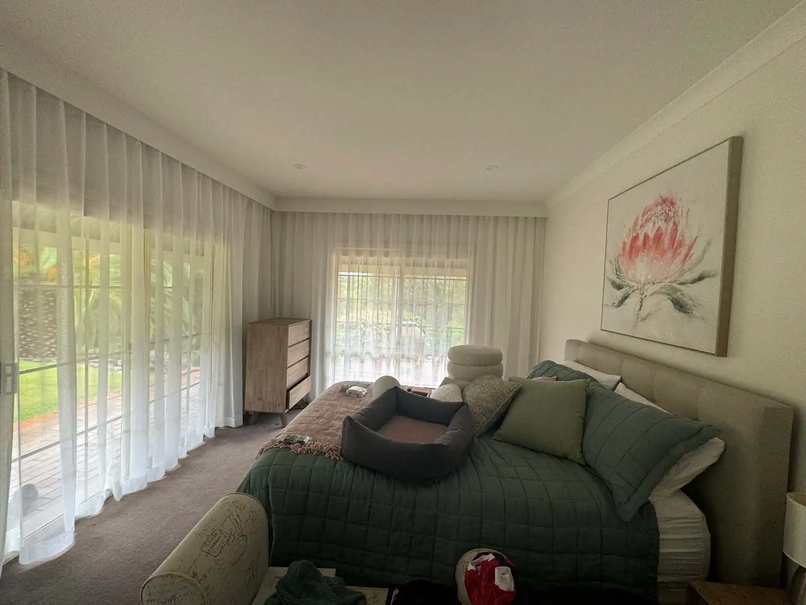 Curtains boost home insulation with thermal-lined fabric over a window.