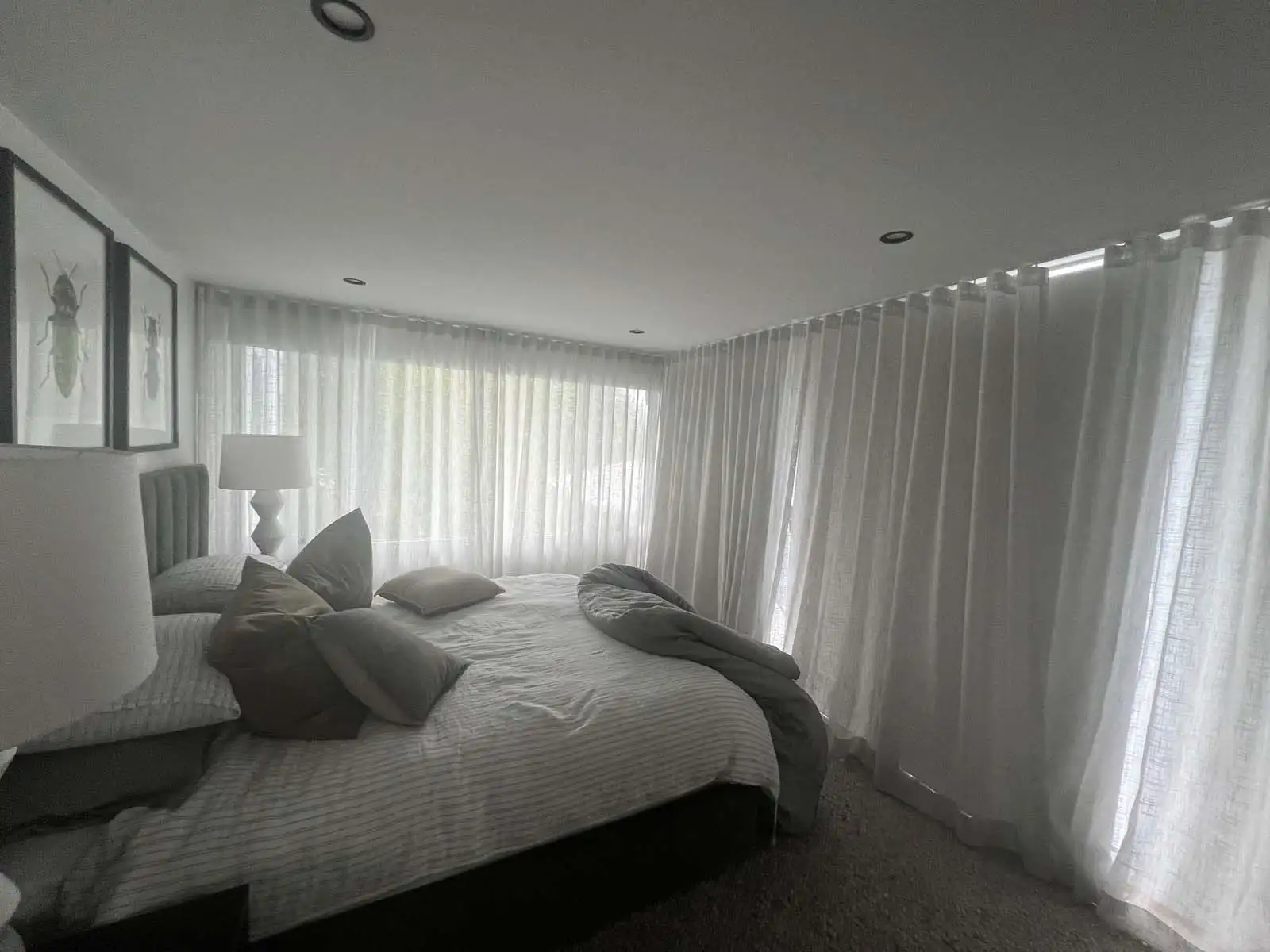 Elegant curtains Central Coast installed in a modern living room for soft light and privacy.