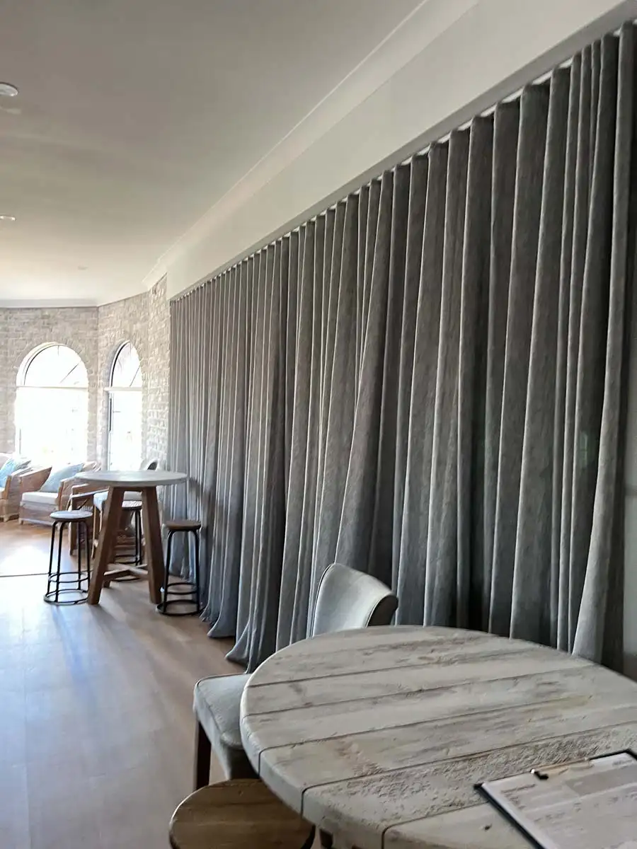 Curtains offering light control flexibility through layering and fabric choice.