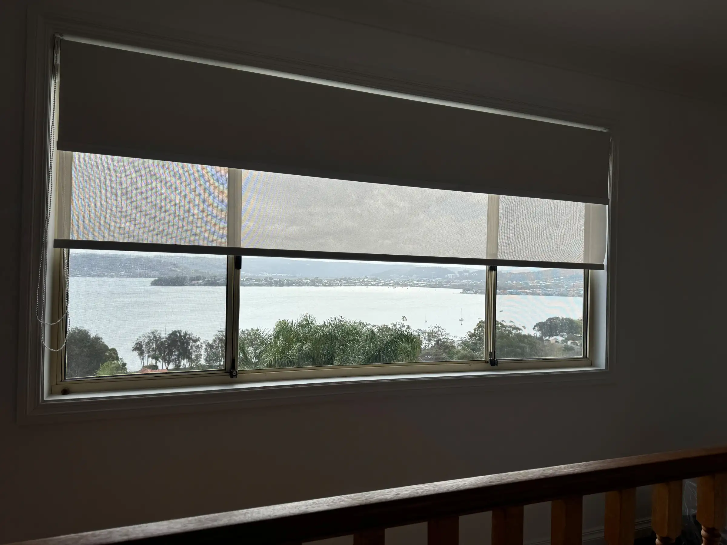 Double roller blinds installed in a Central Coast home providing light control while maintaining the outdoor view.