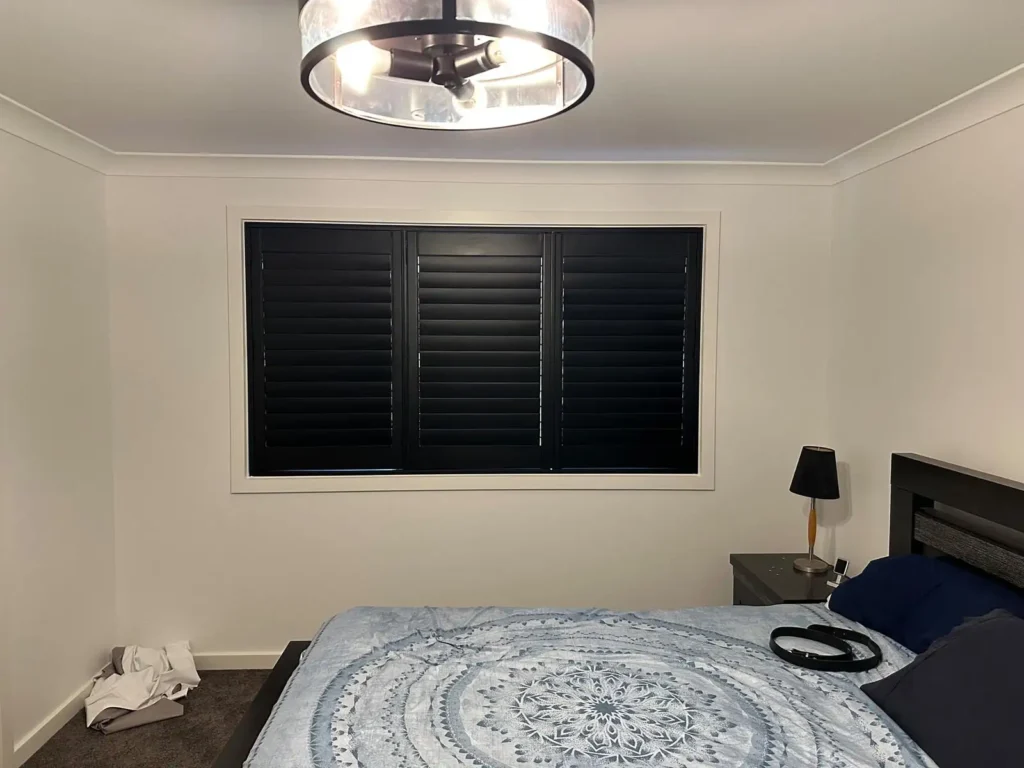 Plantation shutters insulation benefits shown in a modern Australian home, reducing heat transfer and improving year-round energy efficiency.
