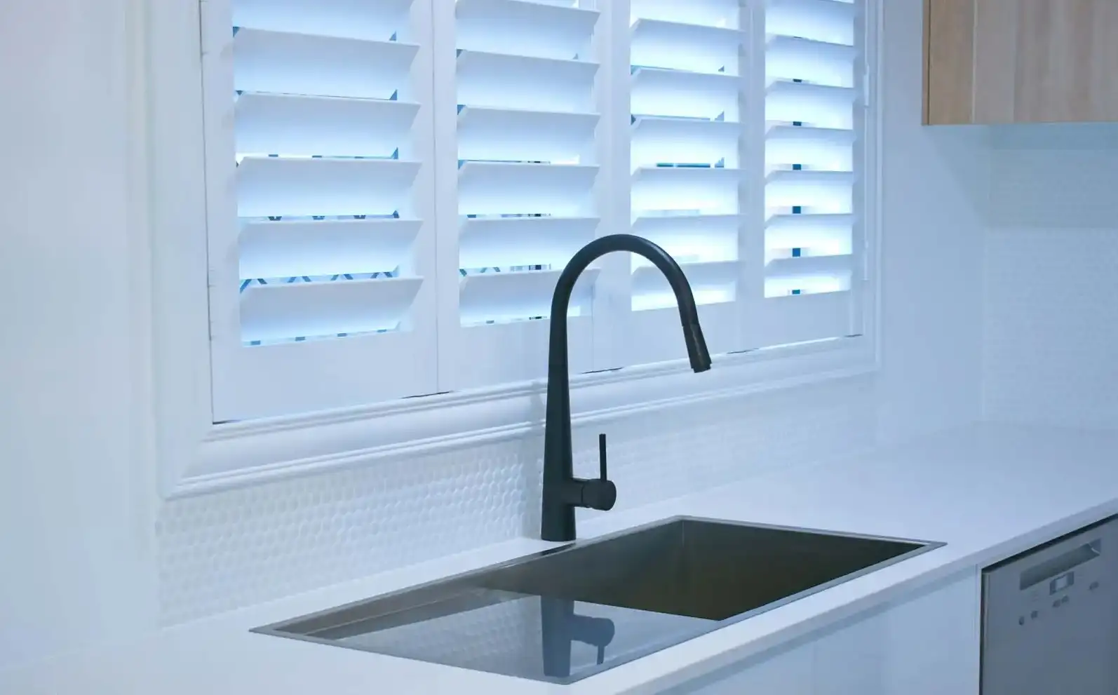 Waterproof PVC plantation shutters installed in a Central Coast kitchen