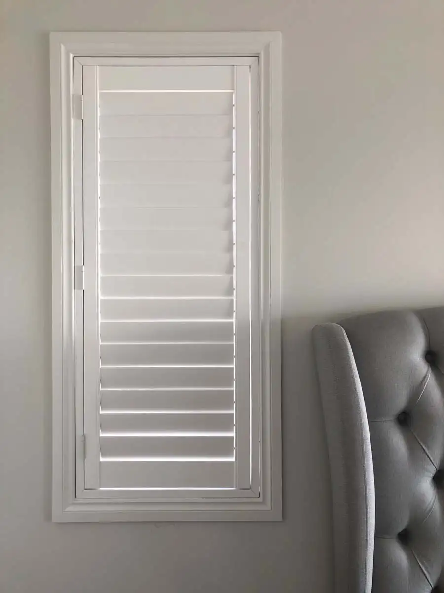 Close-up of plantation shutter hinge placement during Central Coast installation