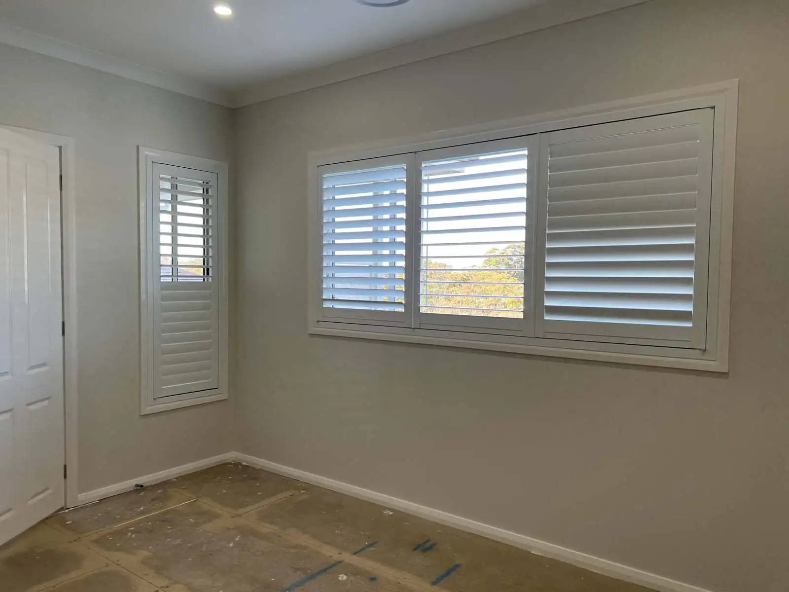 Aluminium plantation shutters Central Coast — modern indoor installation in a bright home interior.