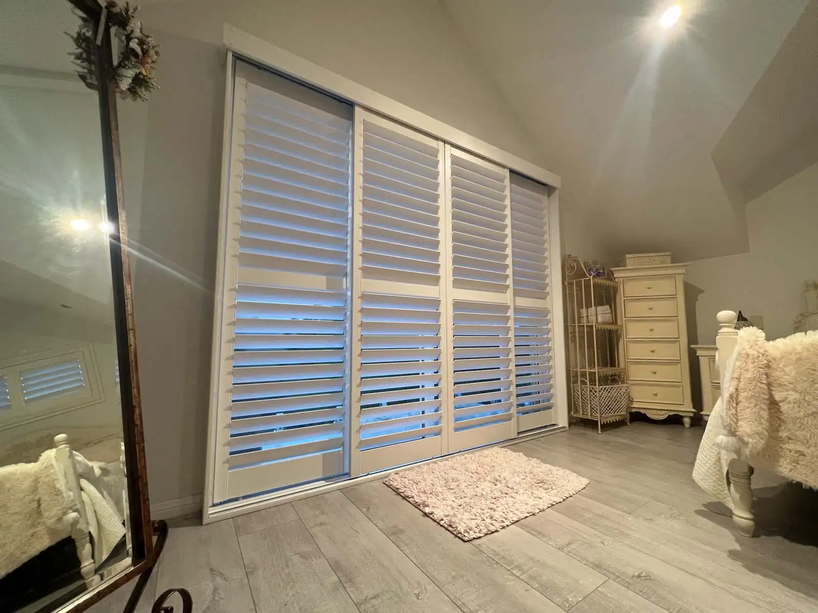 Custom plantation shutters installed on sliding doors in a Central Coast living area