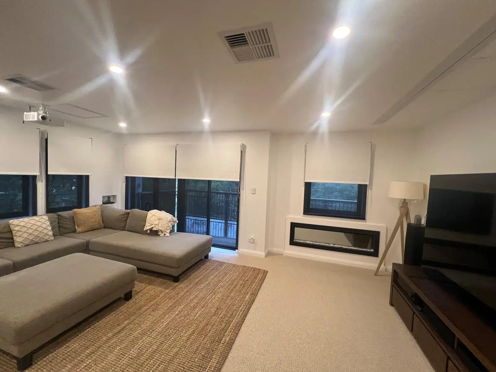 Double roller blinds combining blockout and sheer fabrics in a modern Central Coast living room