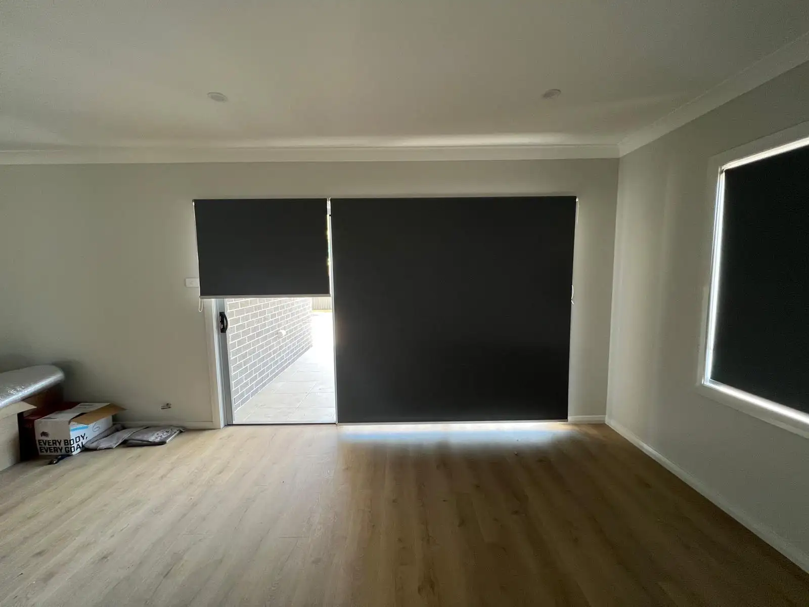 Custom blockout roller blinds fully closed for total light block and privacy on the Central Coast