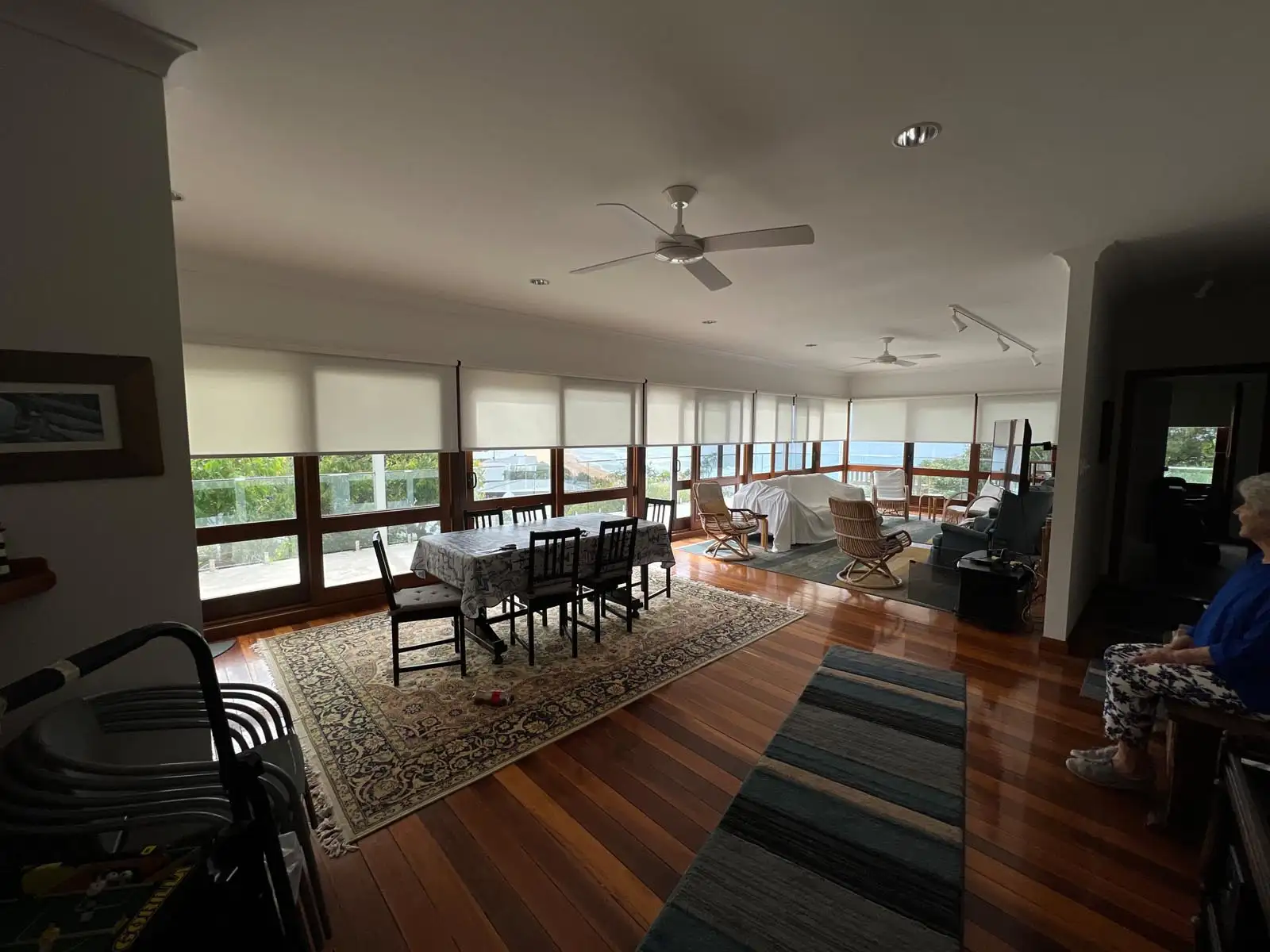 Living Room Roller Blinds – The Blind Crew Roller blinds installed across large living room windows and sliding doors on the Central Coast