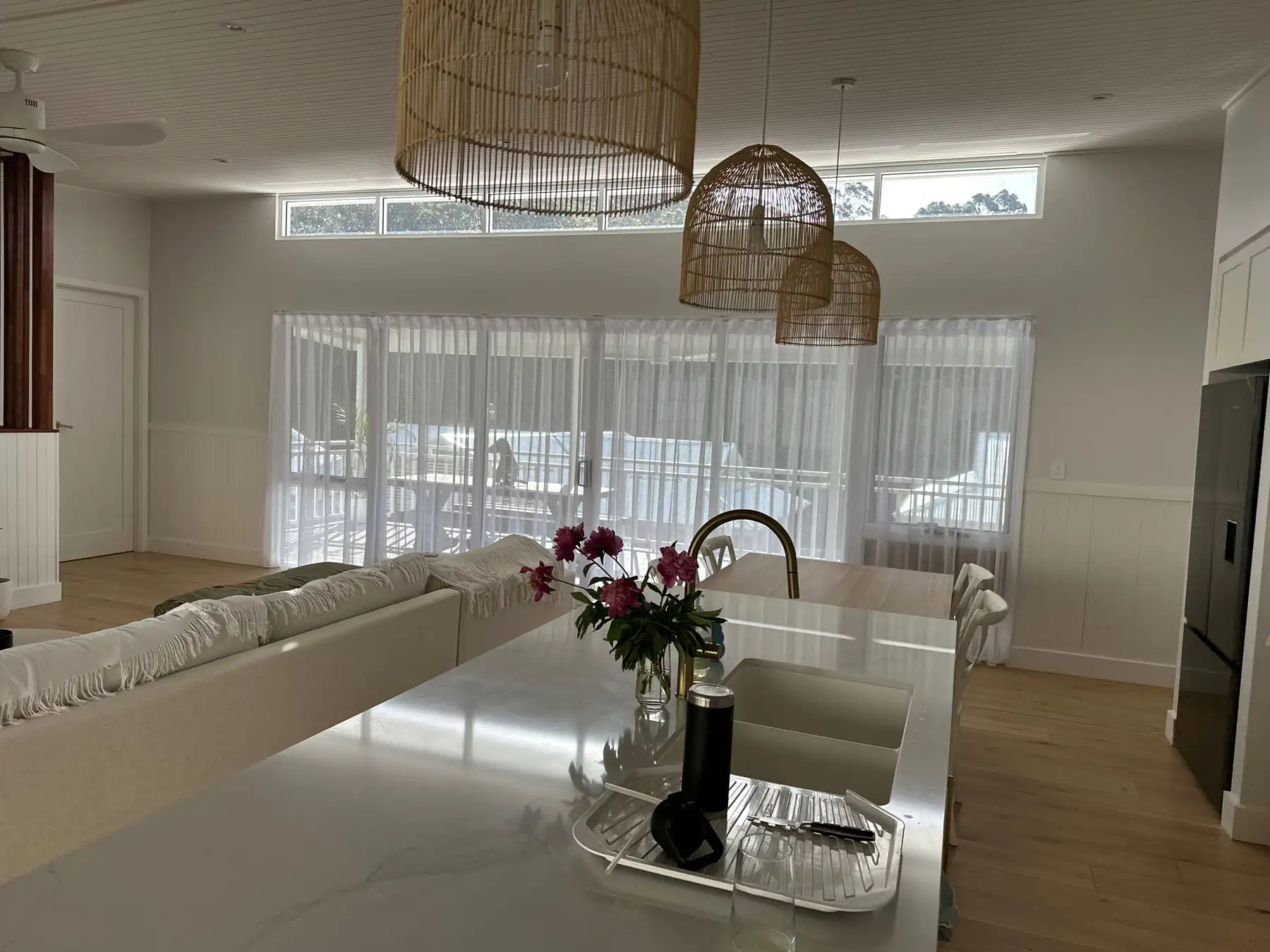 Curtains used as living room blinds in a wide living room view, providing light control and privacy