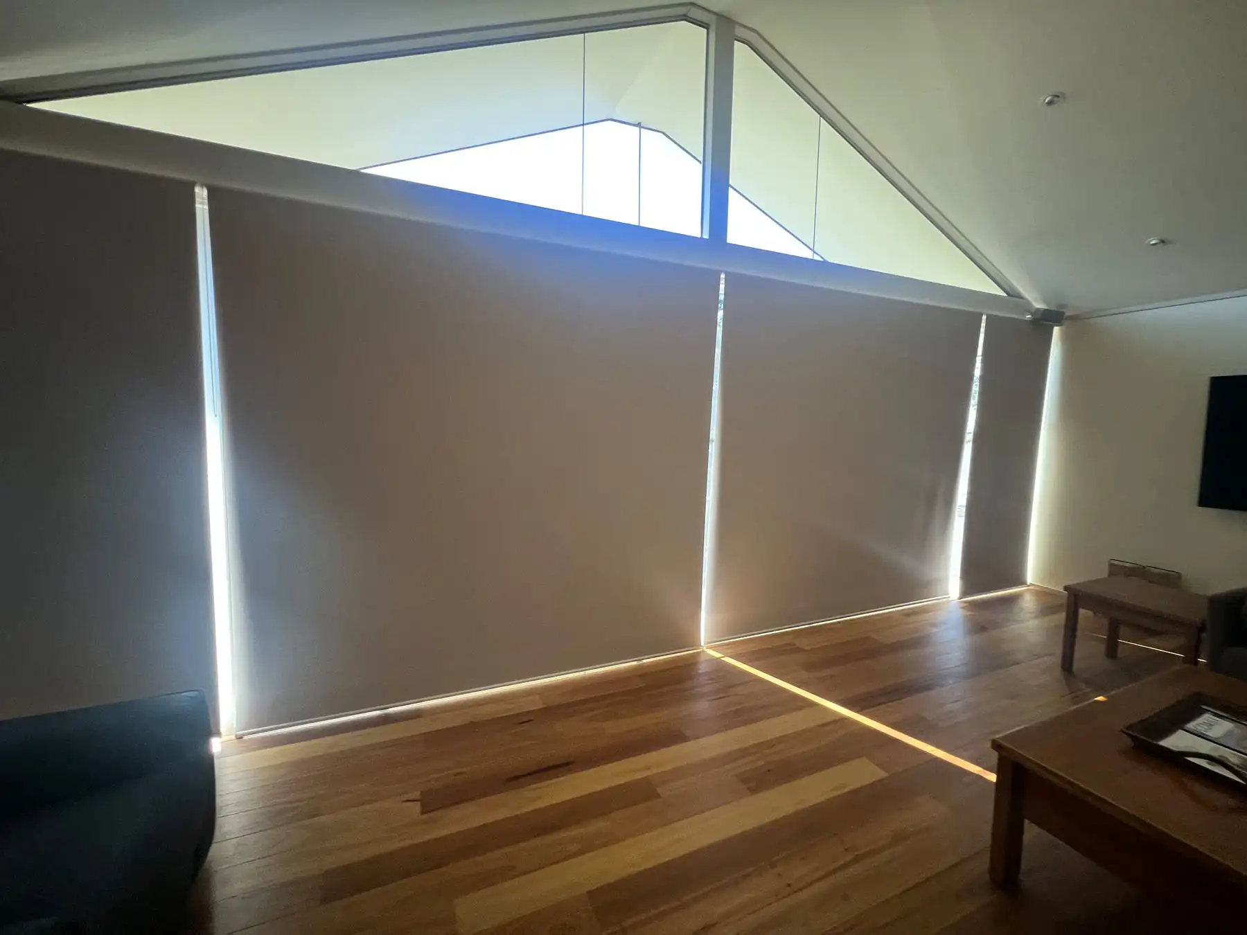 Roller blinds installed as blinds for blinds for sliding doors in a wide interior view, allowing clear door access