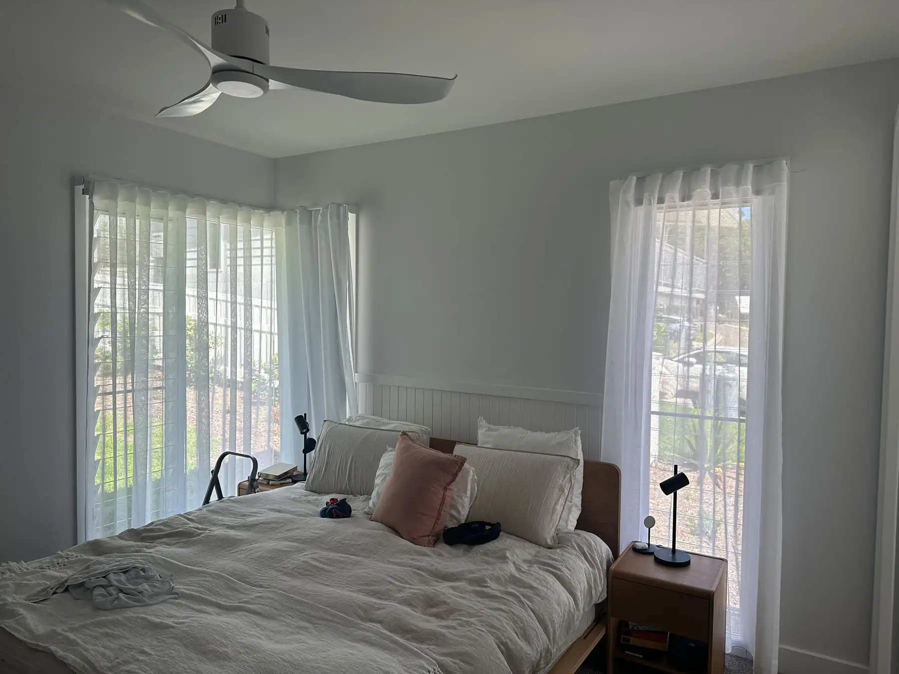 Curtains for Angled Windows Curtains installed as blinds for angled windows in a wide interior view, providing soft light control